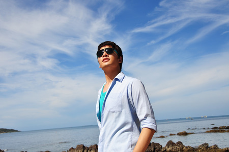Asian men with the skyの写真素材