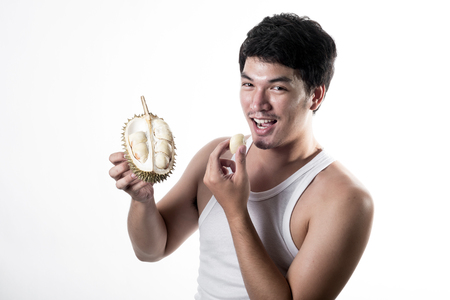 Asian man eating Durianの写真素材
