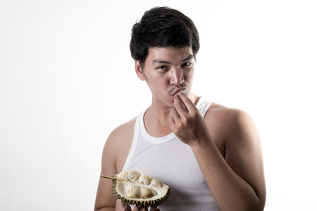 Asian man eating Durianの写真素材