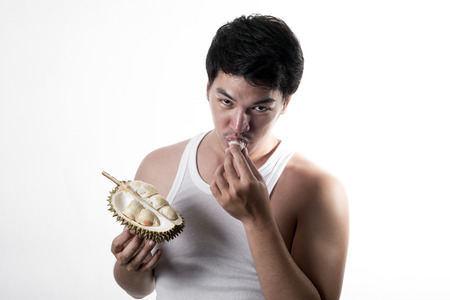 Asian man eating Durianの写真素材