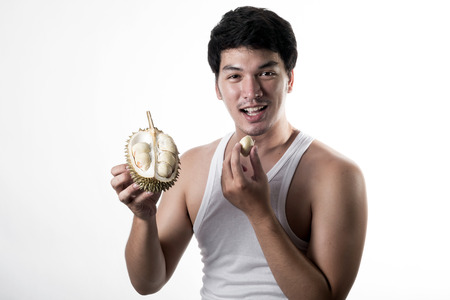 Asian man eating Durianの写真素材