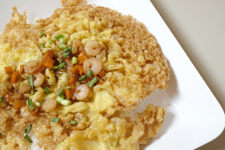 crispy omelet with shrimp and vegetable on topの写真素材