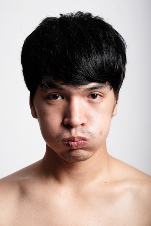 Headshot of Asian man face with no makeupの写真素材