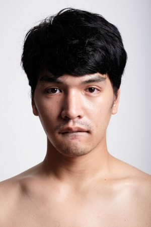 Headshot of Asian man face with no makeupの写真素材