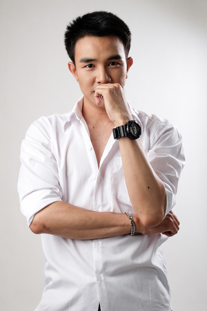 Asian man wear shirt in white backgroundの写真素材
