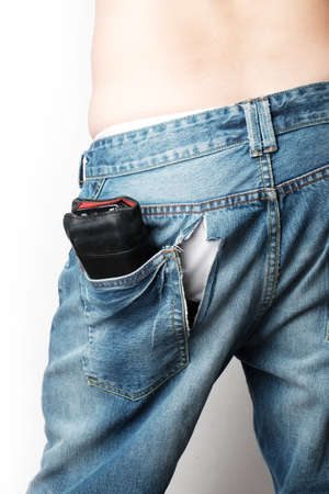 a man wear jeans with trace of theif slitting on itの写真素材