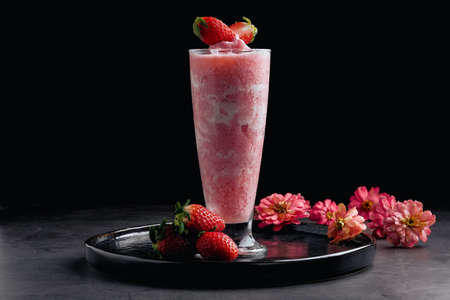 Strawberry smoothhie on black backgroundの写真素材