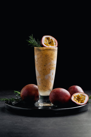Passion fruit smoothhie on black background