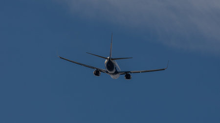 A 737 photographed in a blue sky that has just taken off from EMA airport UK