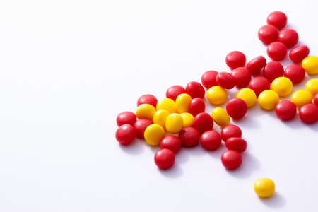 heap of colored candies on white background.の写真素材