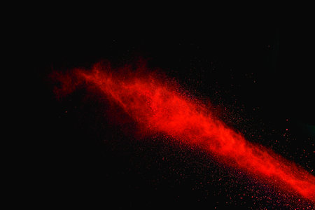 Launched colorful powder on black background