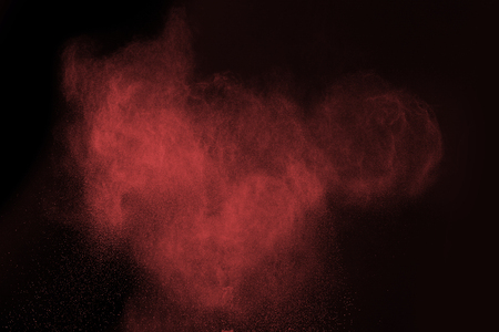 Launched colorful powder, isolated on black backgroundの写真素材