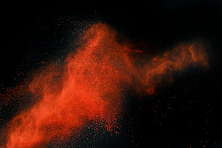 Launched colorful powder, isolated on black backgroundの写真素材
