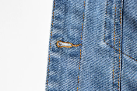 Denim background texture with button hole jacket. Denim blue textile.