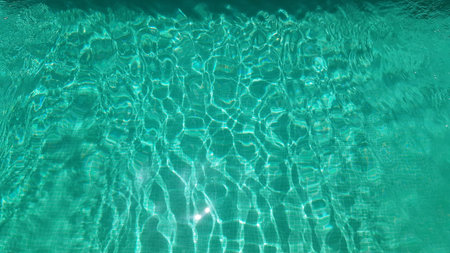 Transparent turquoise water in a pool.