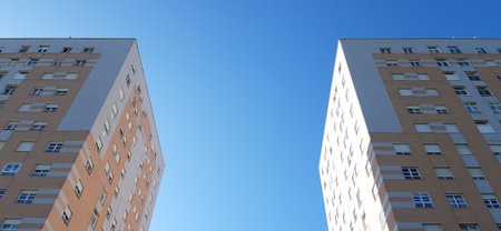 Two parallel buildings that rise 14 floors.