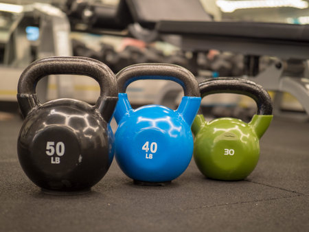 Row of kettlebells in a modern gym.