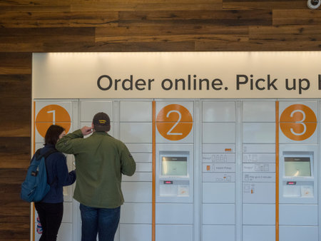 BERKELEY, CA - MARCH 17, 2018: Two patrons using Amazon Locker inside the Amazon Store at the...