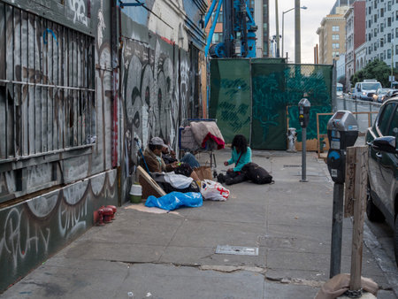 SAN FRANCISCO, CA - MARCH 23, 2018: Homeless people gather on the streets of San Francisco. Finding...