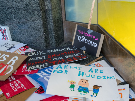SAN FRANCISCO, CA - MARCH 24, 2018: Various discarded signs for the March for Our Lives rally in San Francisco. The rally was one of dozens nationwide that was sparked by the Stoneman Douglas school shootings. Signs are pro-peace, anti-gun, and anti-NRA iのeditorial素材
