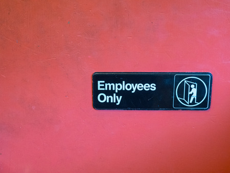 Employees only sign with space to leftの写真素材