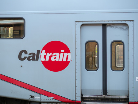 SAN JOSE, CA - APRIL 14, 2018: Caltrain logo on display on side of train next to passenger doorのeditorial素材
