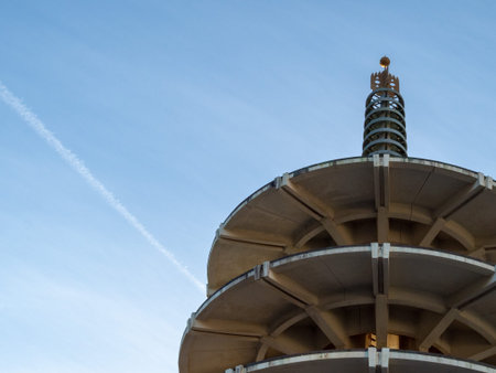Upward view of pagoda with sky trail and space to the left outdoors