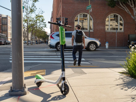 SAN FRANCISCO, CA â€“ APRIL 20, 2018: Lime electric scooter resting at an intersection in San...