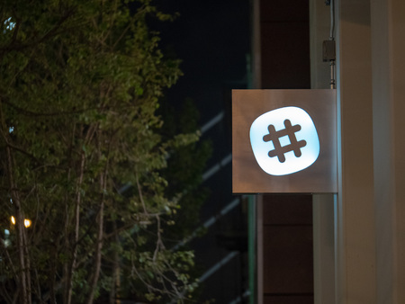 SAN FRANCISCO, CA â APRIL 24, 2018: Slack, communications tool maker, logo outside of San Francisco office locationのeditorial素材