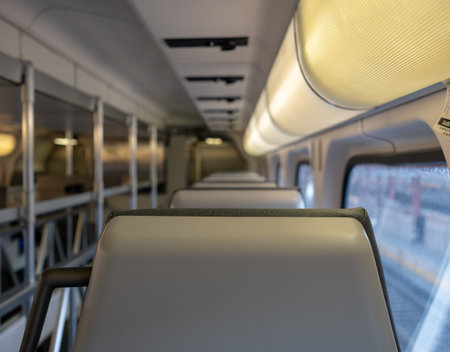 Close up of a train headrest with cargo space in the rear