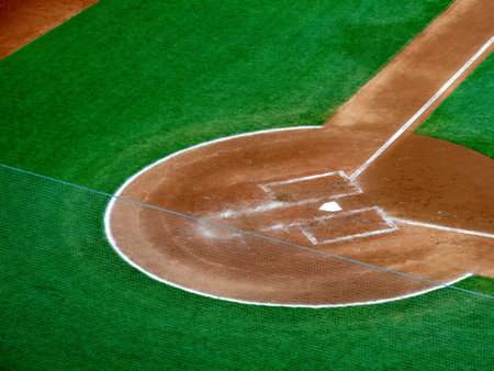 Overhead view of home plate portion of a baseball field at nightの写真素材
