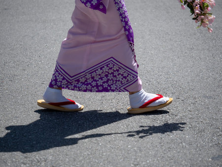 Woman wearing traditional Japanese two toed tabi socks outdoorsの写真素材