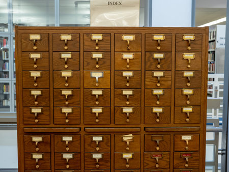 Oak wooden library catalog drawer sitting in a modern library