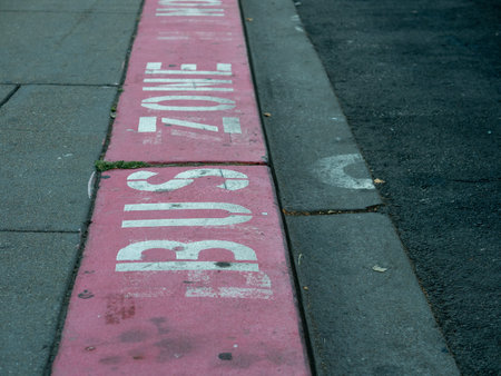 Bus zone red curb restricted area on street