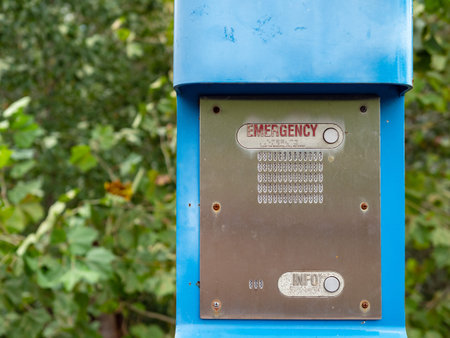 Emergency button, info button and speaker on a blue emergency postの写真素材