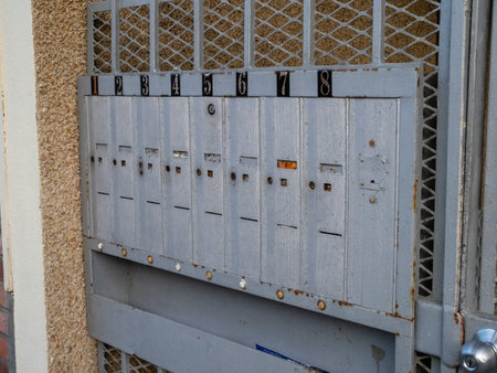 Outdoor apartment mailboxes with rusty look and dirty state units 1 to 8