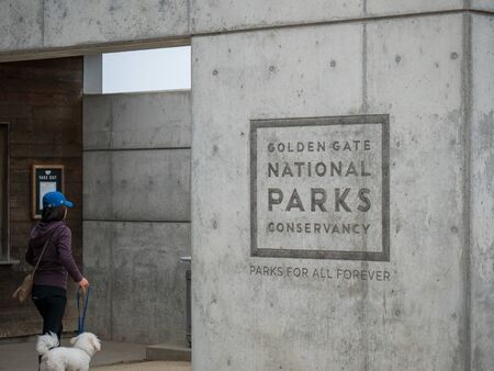 Golden Gate National Parks Conservatory logo with woman walking dogvのeditorial素材