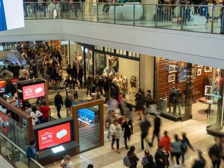 Customers walking through a shopping mall in the busy holiday seasonのeditorial素材