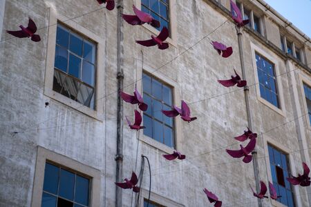 Decorative paper birds strung up in decorative commercial settingの写真素材