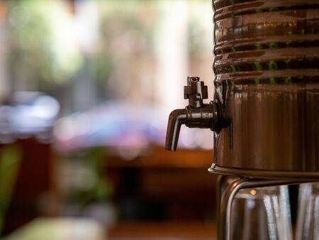 Steel water cooler with manual faucet for dispensing some drinking waterの写真素材