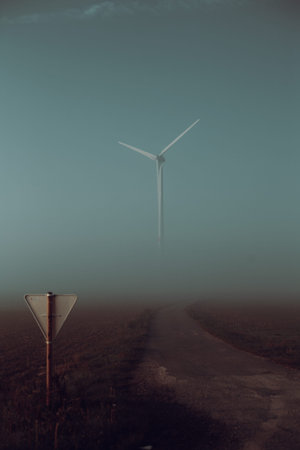 Wind turbine in the fog - in the Belgian countryside