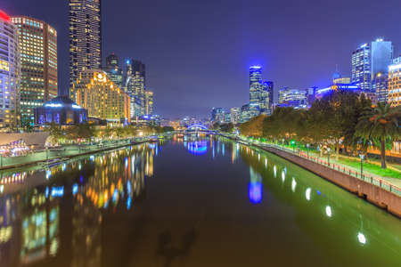 Melbourne, Australia - Long exposure image of City skyline of Melbourne downtown, Princess Bridge,  Yarra River and business building at nightの写真素材