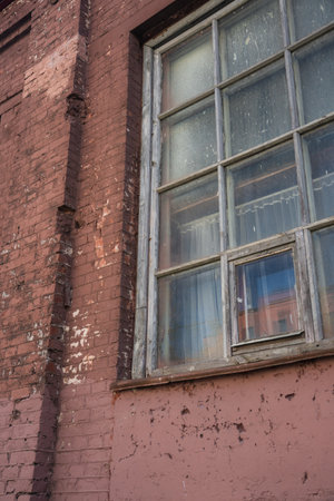 The window of an old, abandoned factory. High quality photoの写真素材