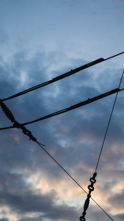 Power lines cross the sunset sky. High quality photoの写真素材