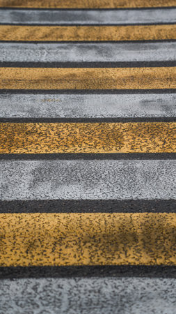 Pedestrian crossing, yellow and white zebra. High quality photo