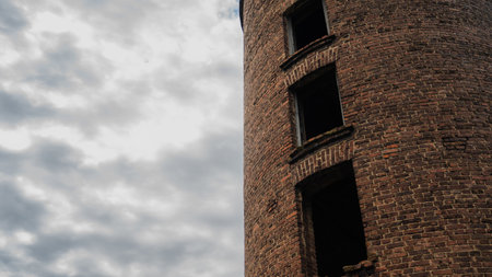 Brick tower overlooking the cloudy sky. High quality photoの写真素材