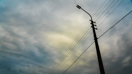 street lamp with a view of the cloudy skyの写真素材