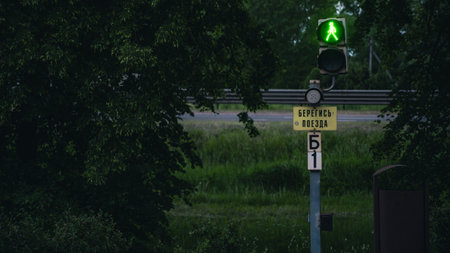 Railway, pedestrian traffic light with the sign Beware of the trainの写真素材