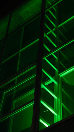 green decorative staircase on the facade of the building. Neon Light