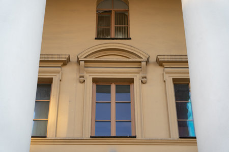Vintage, old building. Windows between the columns. Framing